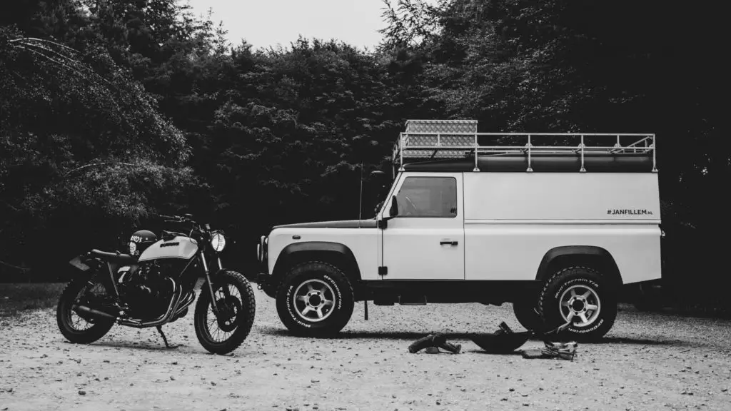 Dirt bike next to car